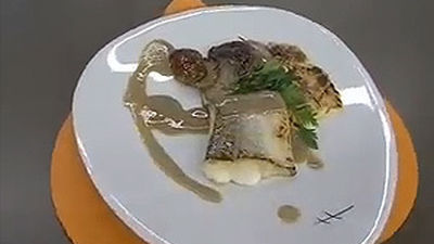 Lomo de merluza con hongos y rabo de ternera glaseado