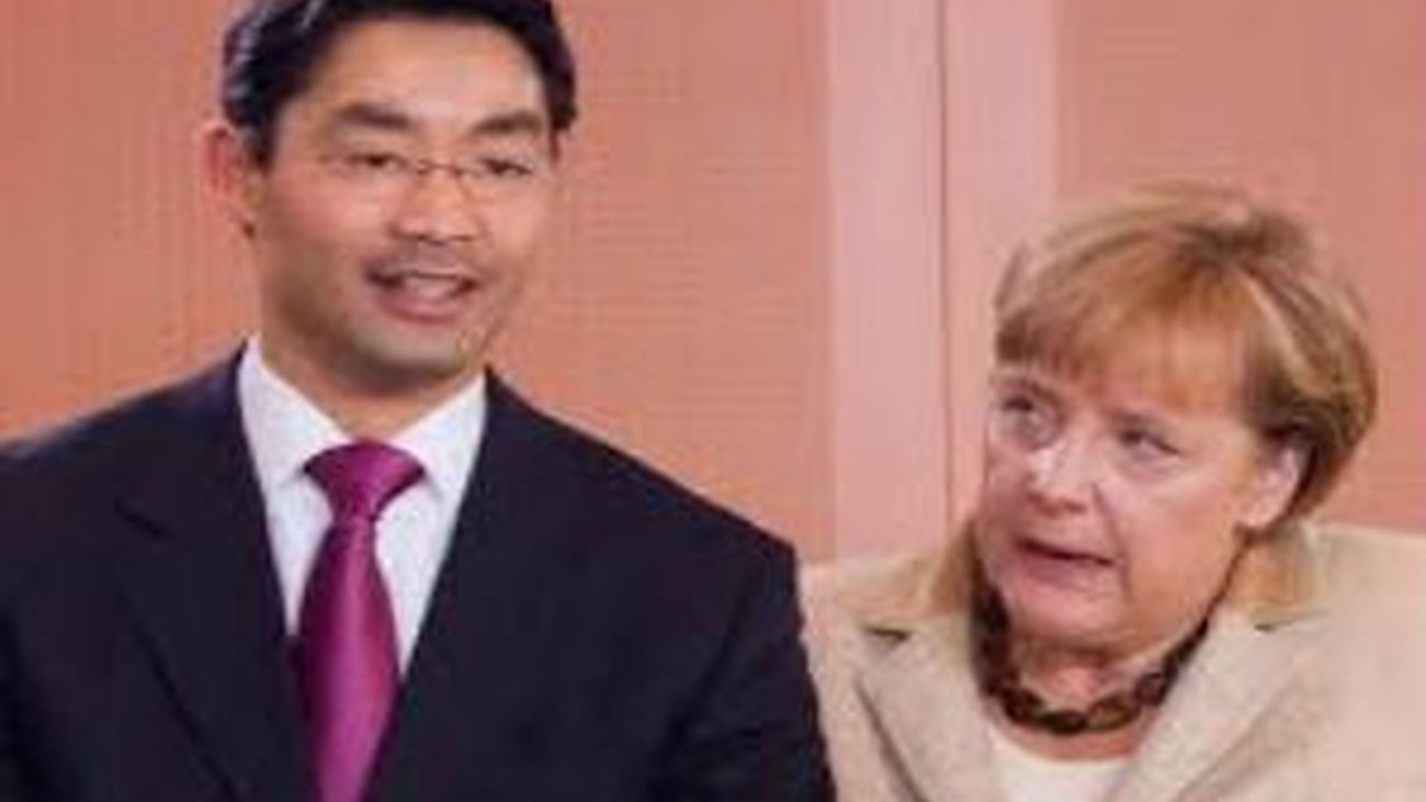 Philipp Rösler y Angela Merkel