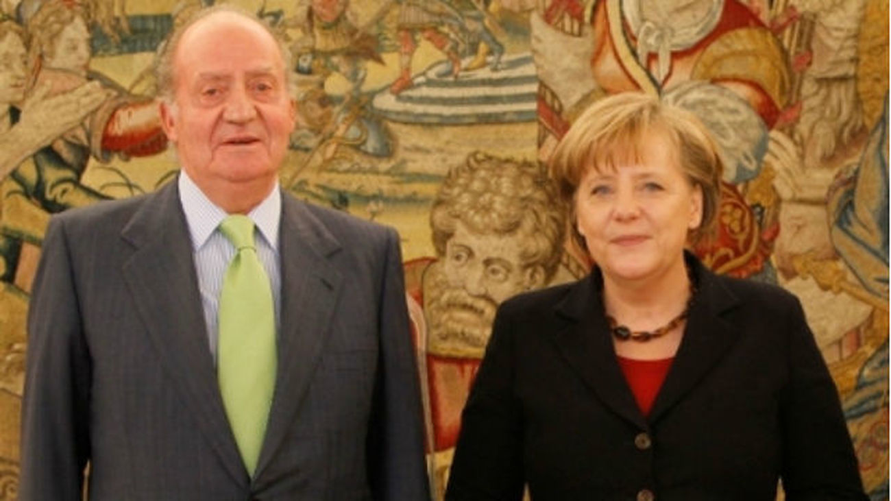 Don Juan Carlos y Merkel