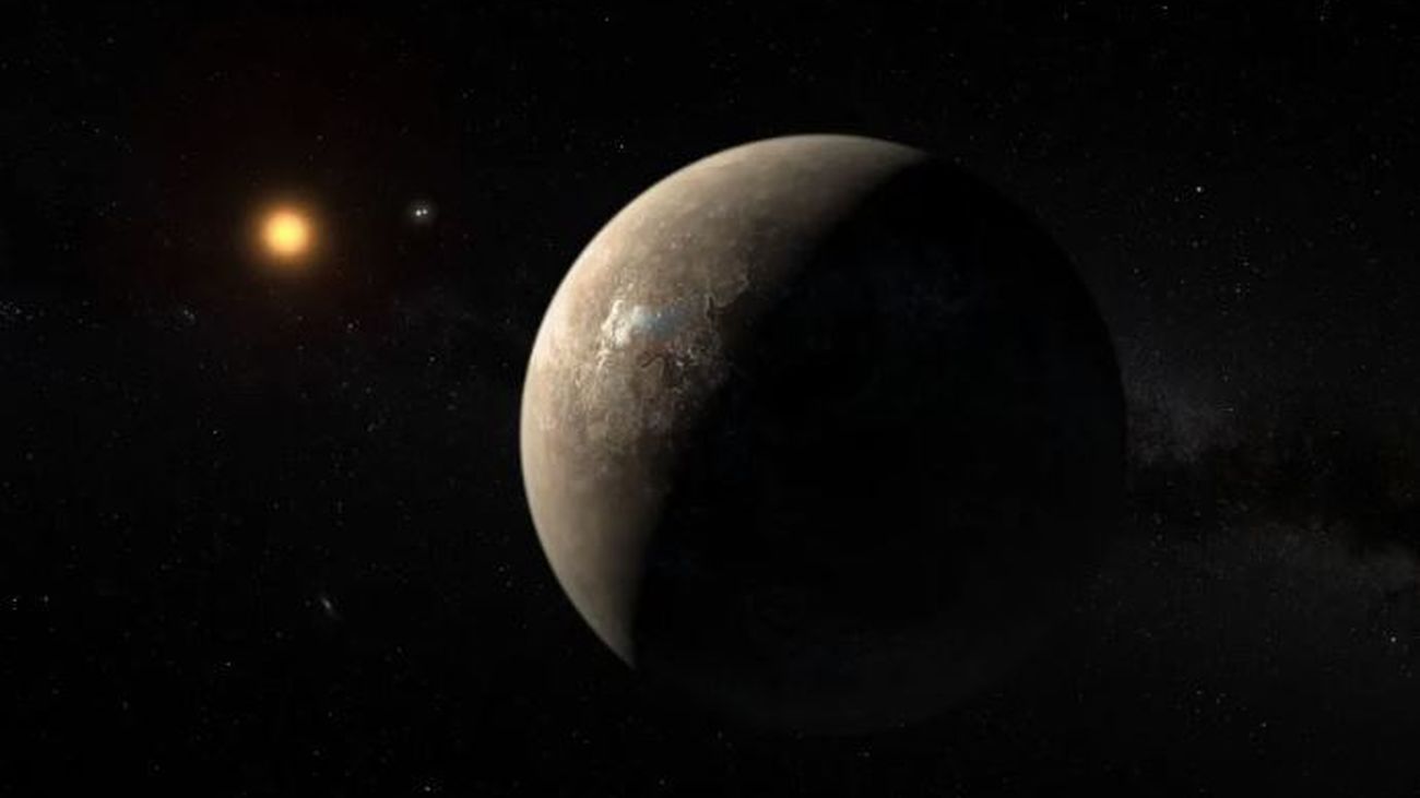 Recreación del planeta Próxima b orbitando la estrella enana roja Próxima Centauri