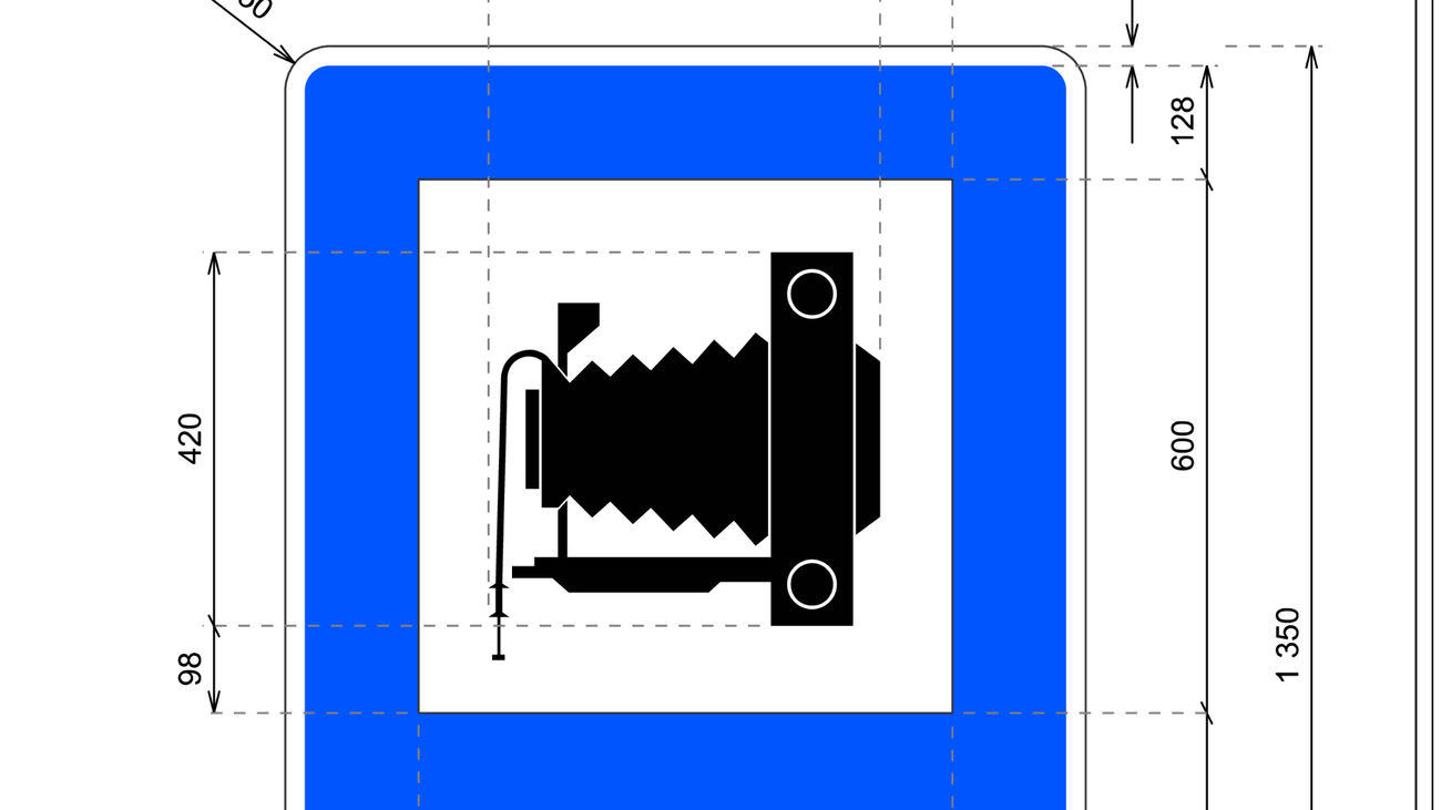 Imagen de una señal de indicación de lugar pintoresco con una cámara de fotos