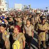 Integrantes de las Fuerzas Armadas Revolucionarias de Cuba asisten a la conmemoración del Día Internacional del Trabajo este viernes, en La Habana